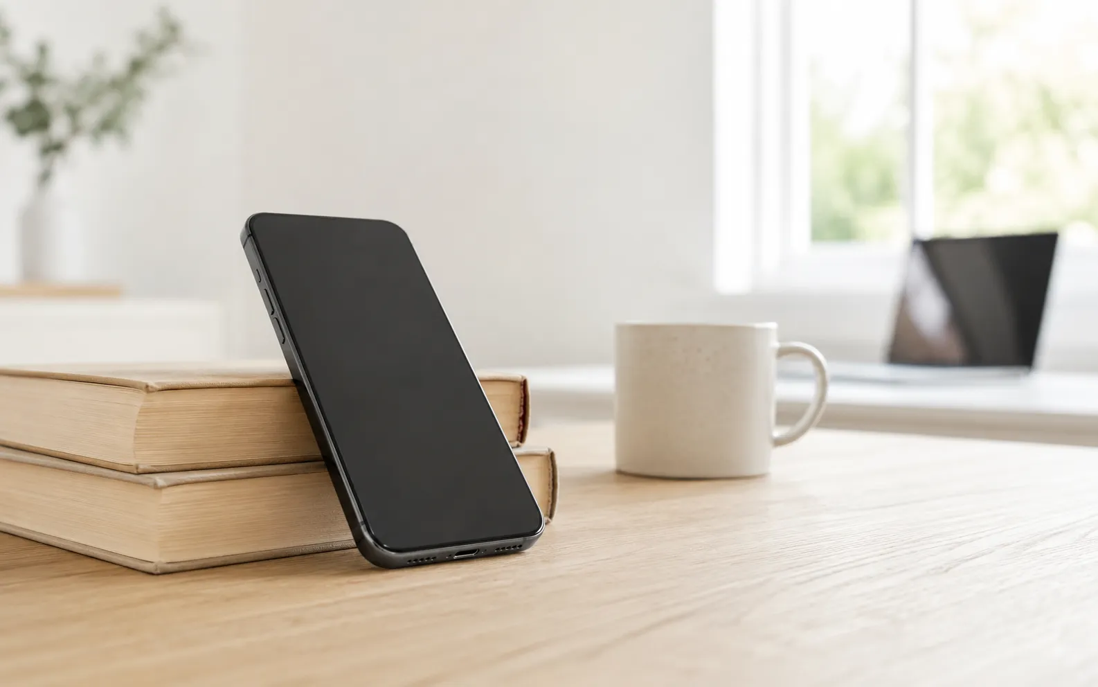 A phone propped against a hard surface with its speaker directed into the room to project sound
